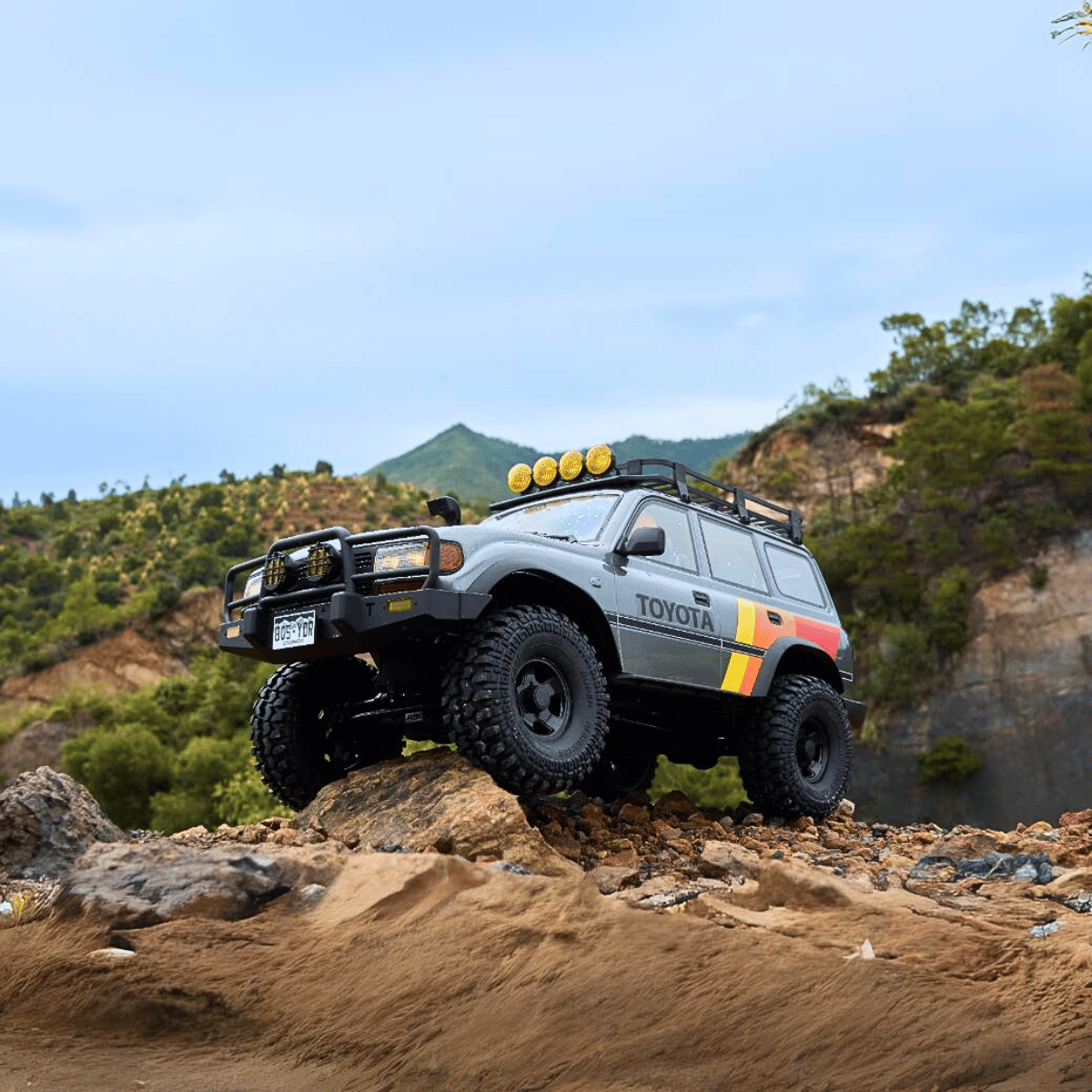 FMS 1:10 FCX10 LC80 Toyota Land Cruiser 80, grey scale RC crawler on rocks