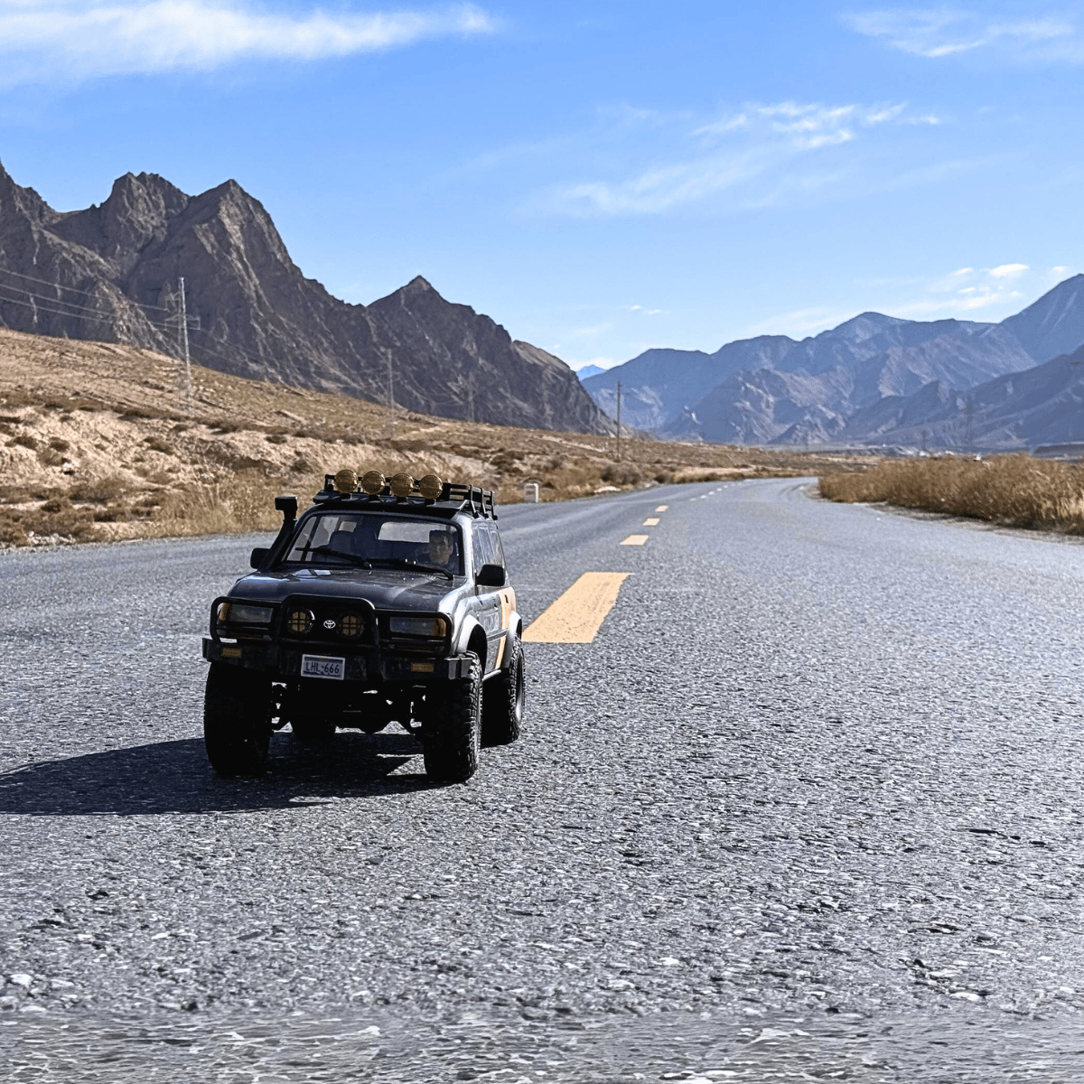 FMS 1:10 LC80 Toyota Land Cruiser RC crawler on mountain road