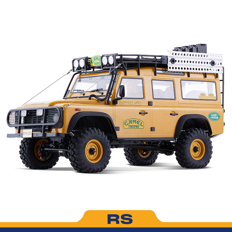 FMS 1:10 scale RC Defender Camel Trophy Edition RS, yellow, with roof rack and off-road tires.
