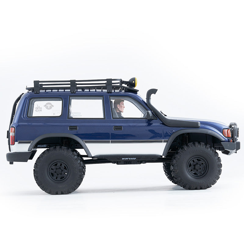 FMS FCX10 PRO Brushless Toyota Land Cruiser LC80 RS V2 RC car, blue/white, off-road tires, roof rack, snorkel
