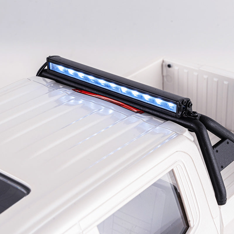 1:18 GMC Sierra S RC truck roof with illuminated blue LED light bar.