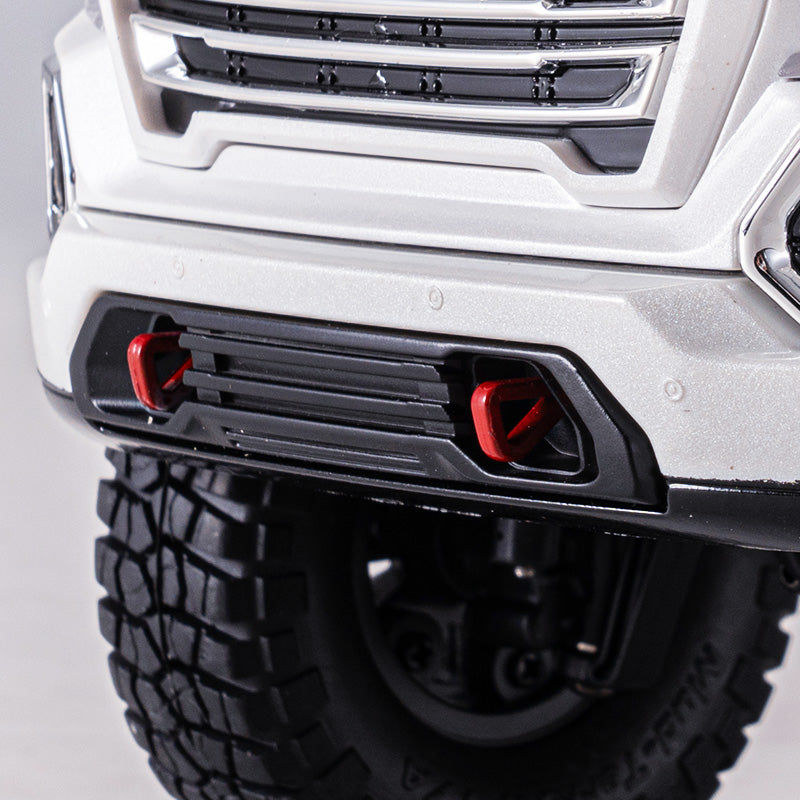 White 1:18 GMC Sierra S RTR RC truck front bumper, black grille, red tow hooks, knobby tire.