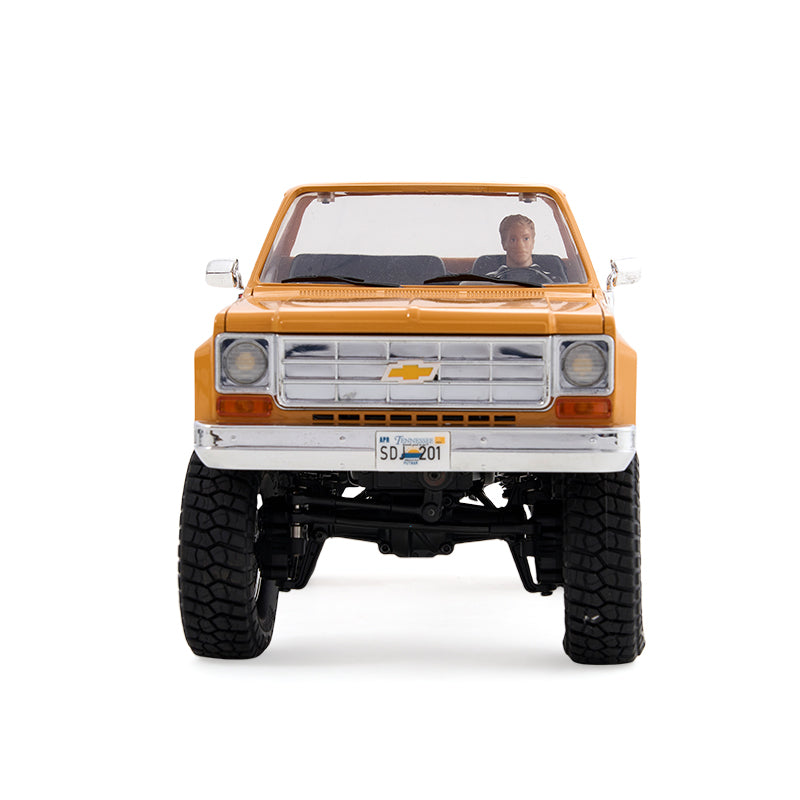 Yellow FMS 1:18 FCX18 Chevrolet K10 V2 RTR RC truck with detailed grille and off-road tires.