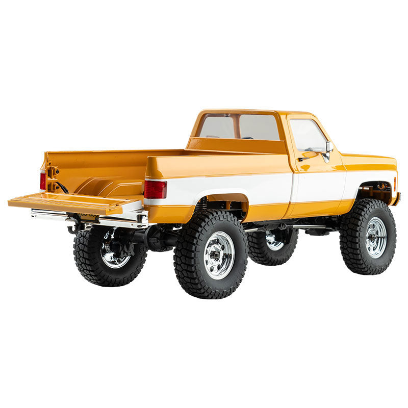 FMS 1:18 FCX18 Chevrolet K10 V2 RTR yellow and white pickup truck with off-road tires