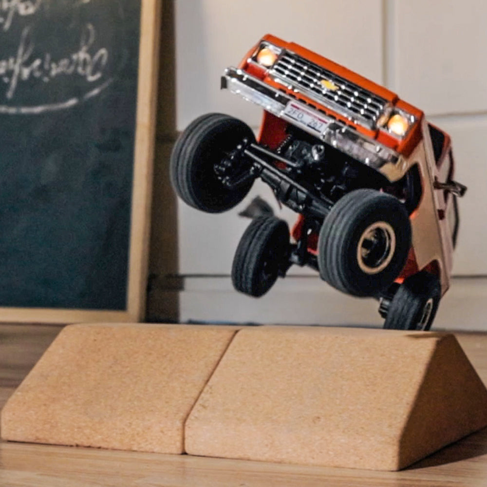 FMS 1:24 FCX24 Chevrolet K5 Blazer RTR orange RC truck mid-air jump over ramp