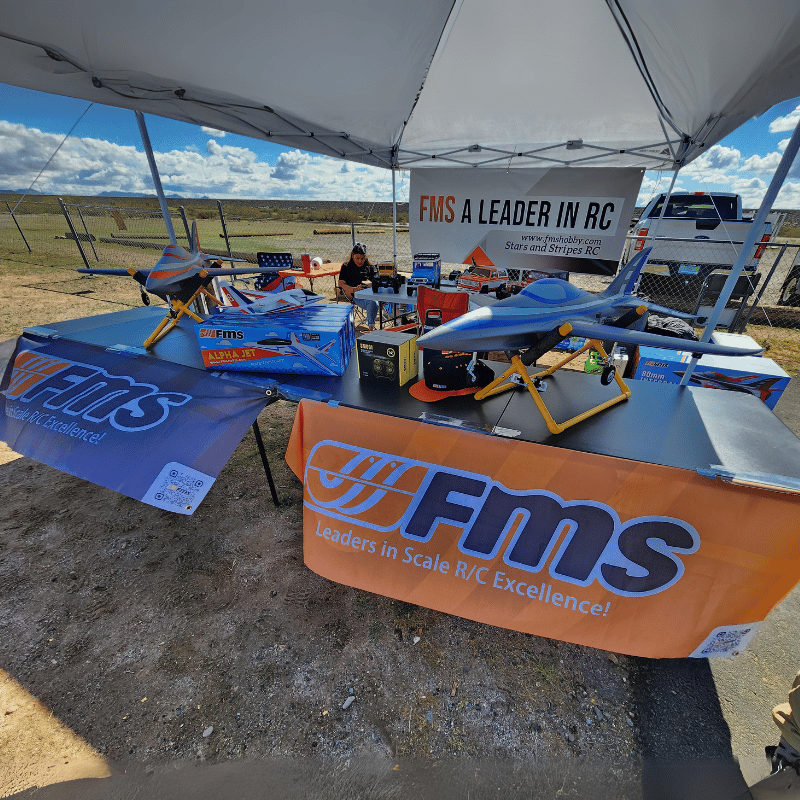 FMS RC models displayed with tent, slogan, and engaging product showcase