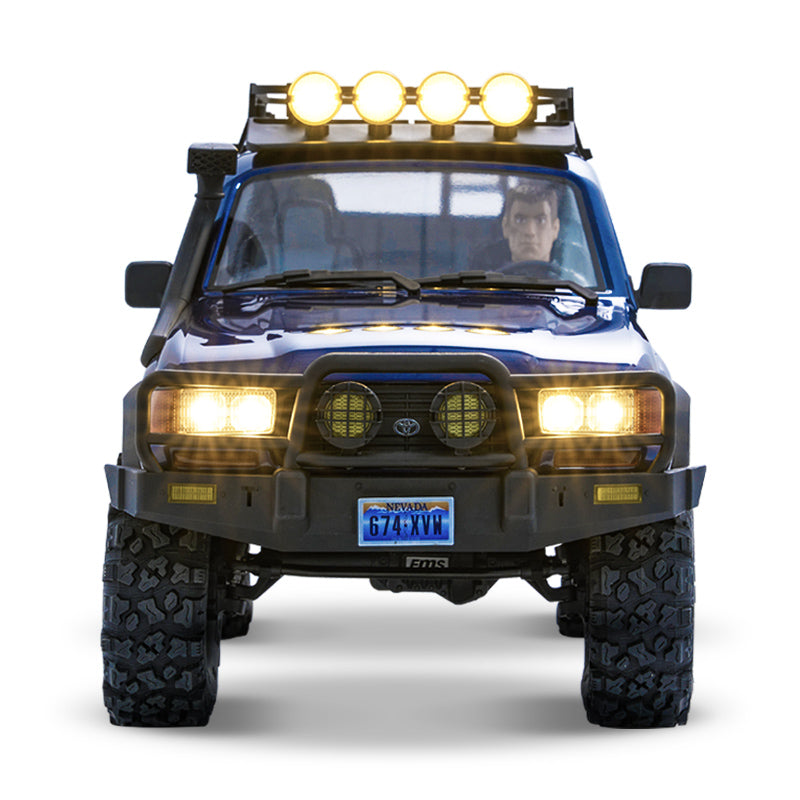 FMS 1:10 FCX10 PRO Toyota Land Cruiser LC80 RS V2 RC car, blue with roof lights and bull bar.