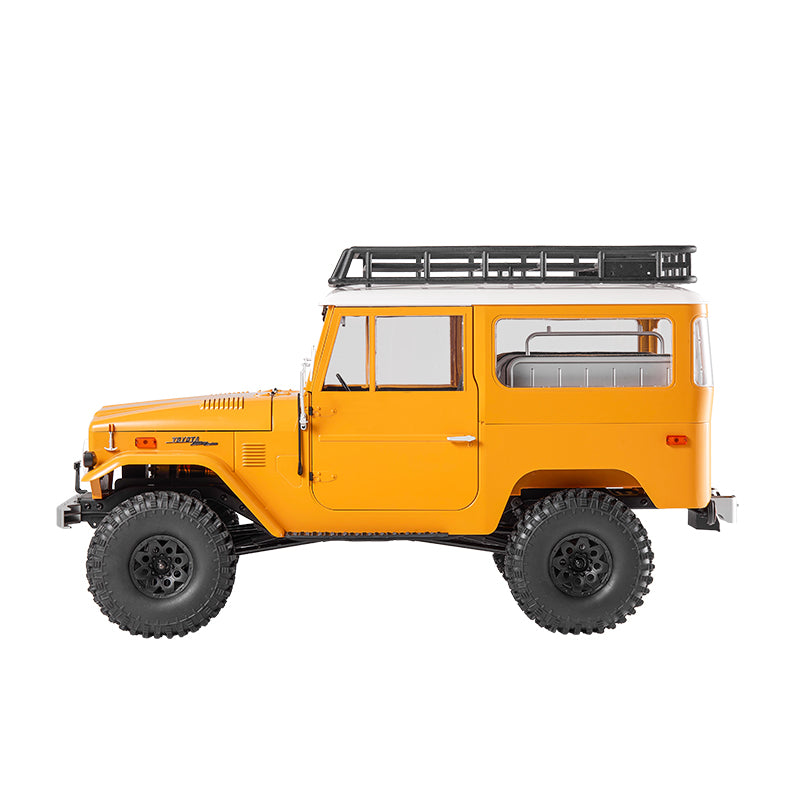 Yellow FMS 1:10 Toyota Land Cruiser FJ40 RS RC car with roof rack, detailed exterior and off-road tires.