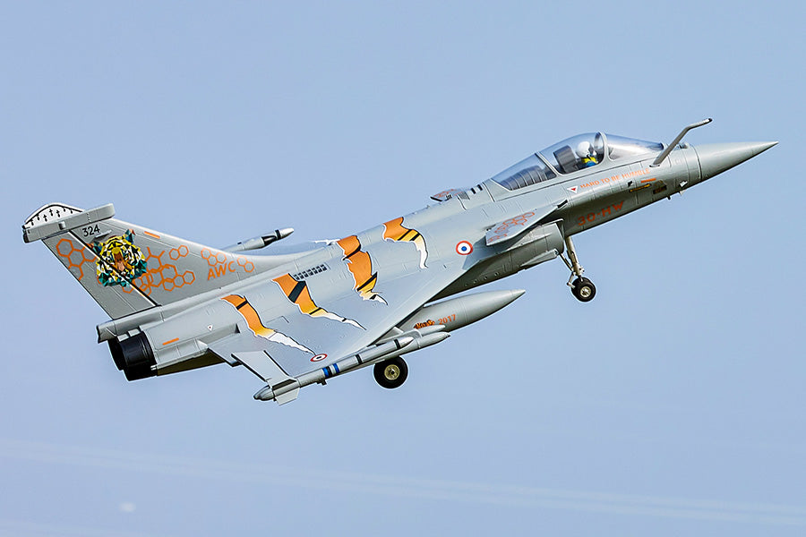 FMS 64mm Rafale jet, NATO Tiger Meet livery, flying with landing gear down. Tiger graphic & orange claw marks.