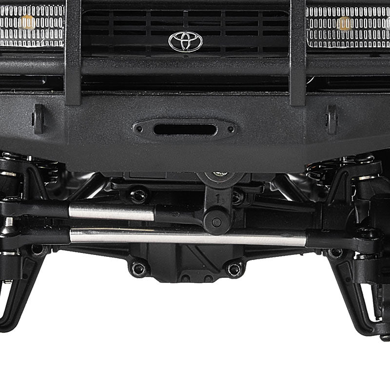 FMS 1:18 LC80 Toyota Land Cruiser 80: Close-up of front bumper, grille with Toyota logo, and suspension.