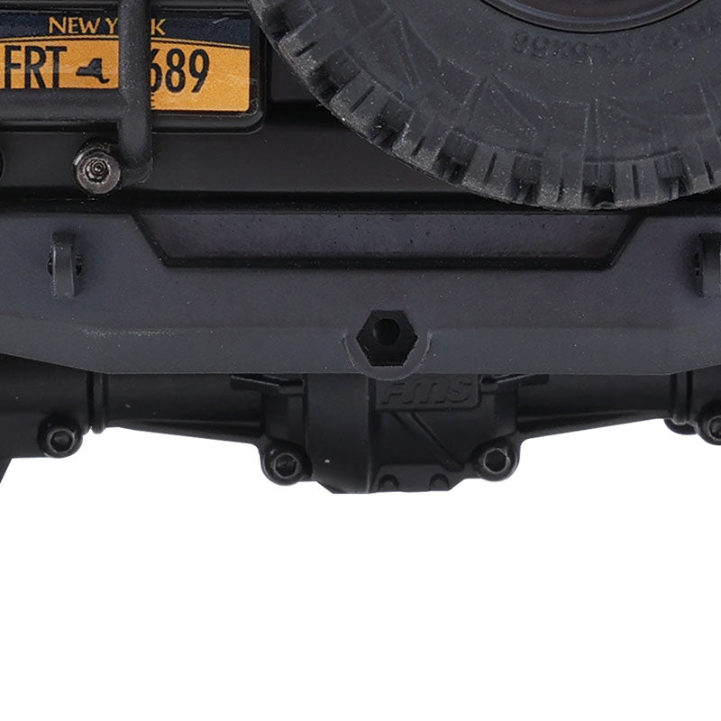 FMS Land Cruiser 80 RC car rear axle with 'FMS' logo detail and license plate 'NY FRT 4 689'