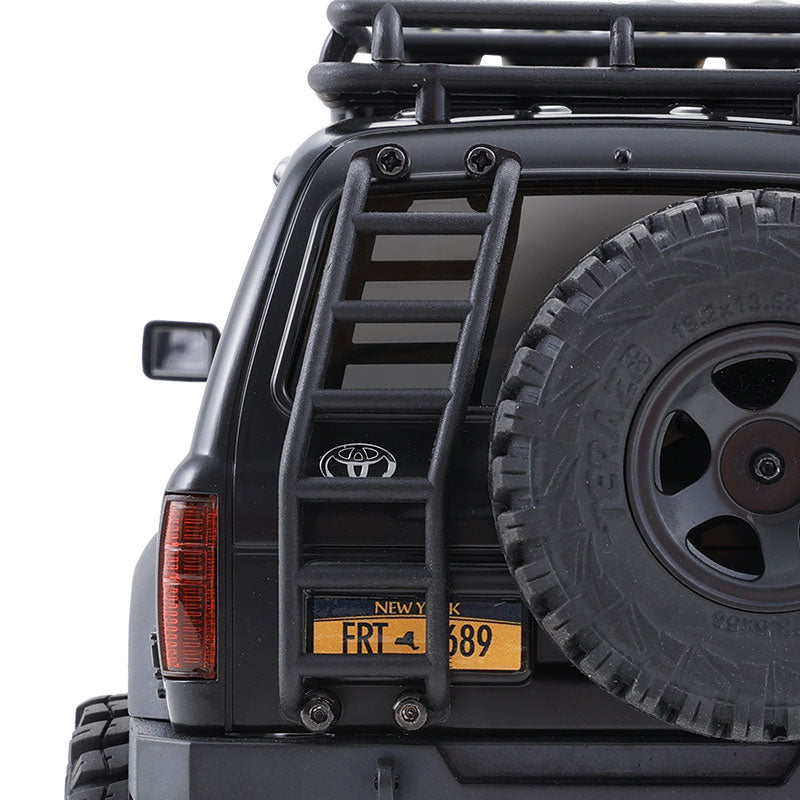 Black FMS 1:18 LC80 Toyota Land Cruiser 80 features a rear ladder, spare tire, and 'NEW YORK' license plate FRT-689.