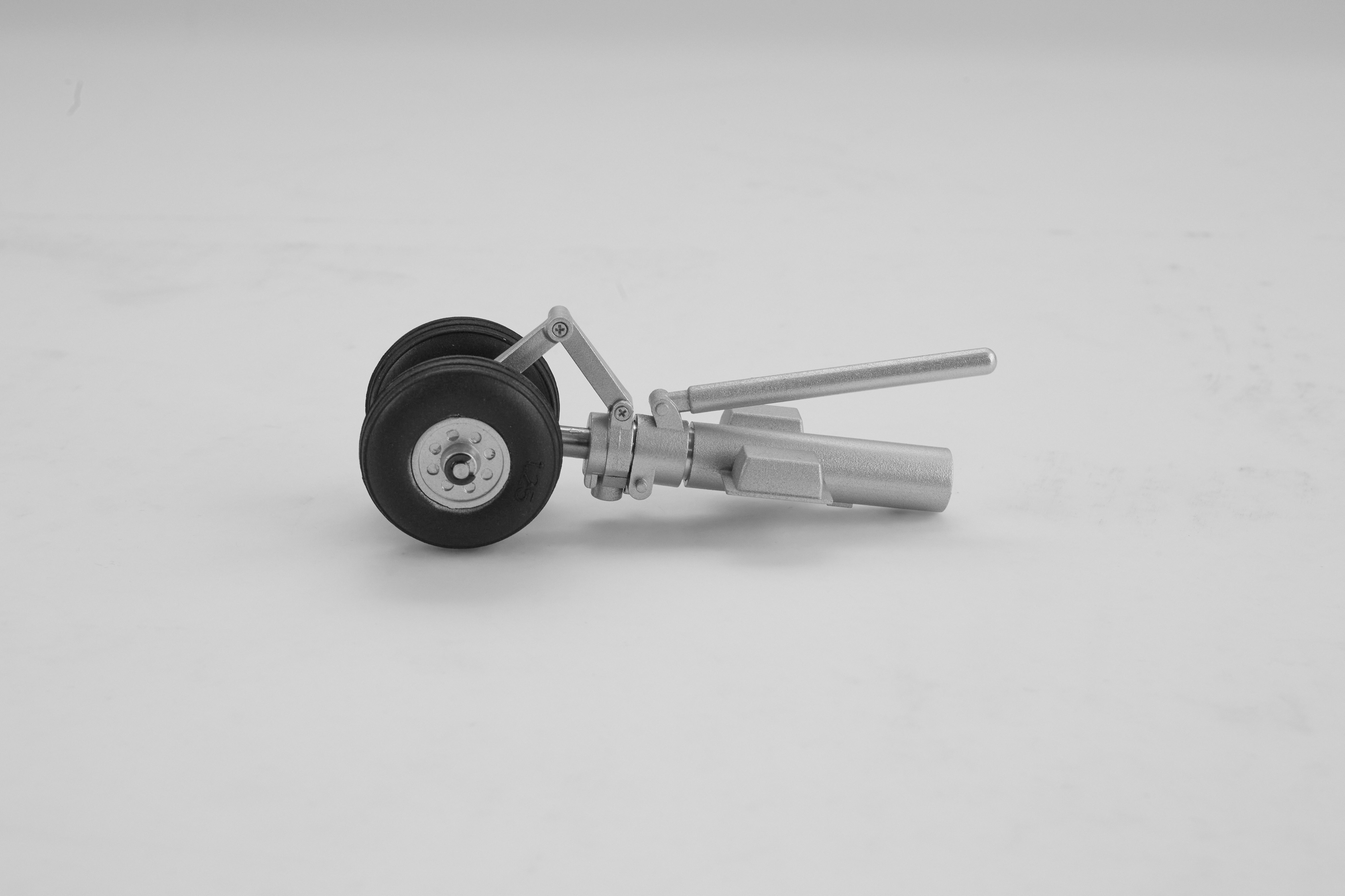 Front landing gear set for 64mm Rafale EDF Jet, featuring black wheels.