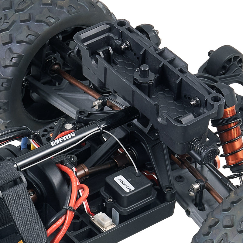 FMS 1:10 Colorado basher chassis detail: drivetrain, orange shocks, receiver box