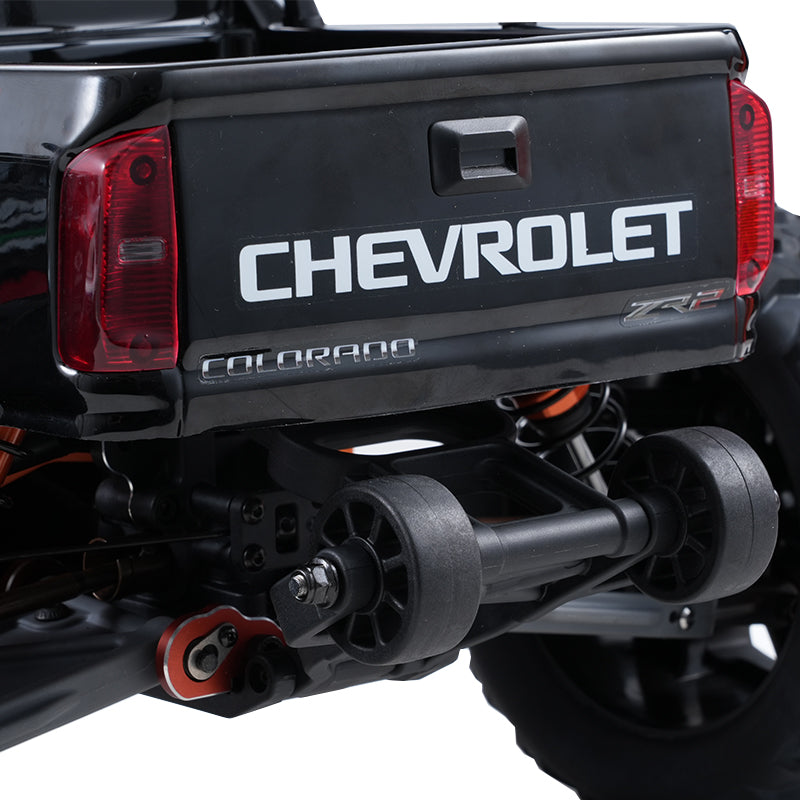 Black FMS 1:10 Chevrolet Colorado Basher RS rear view with Chevrolet branding and suspension details.