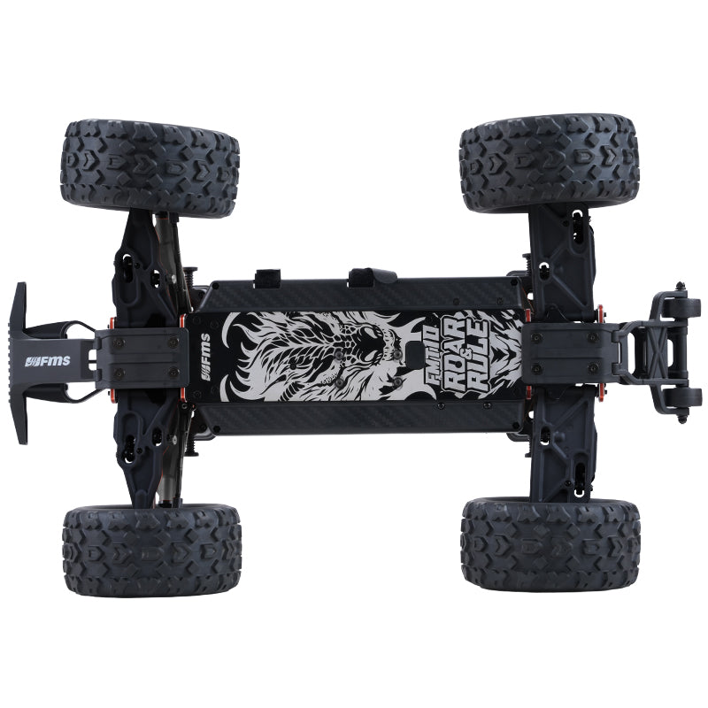 FMS 1:10 FMT10 Chevrolet Colorado Basher RS 4WD chassis with roaring lion graphic and large knobby tires.
