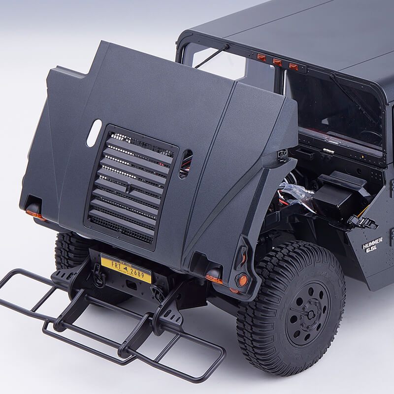 FMS 1:12 Hummer H1 Alpha RTR, hood open, showing detailed interior, bull bar, and rugged tires.