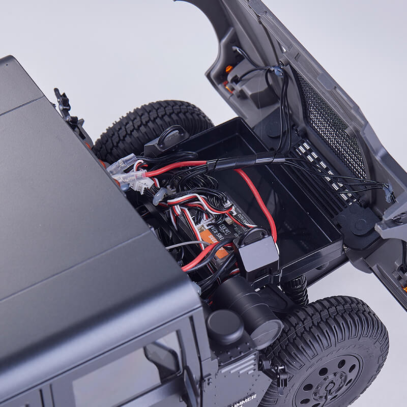 FMS 1:12 Hummer H1 Alpha RTR engine bay with visible wiring, ESC, and open hood.