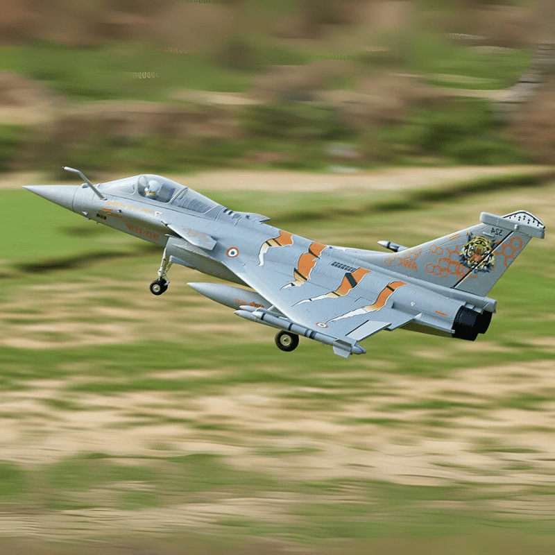 FMS 64mm Rafale EDF jet airborne with vibrant NATO Tiger Meet color scheme