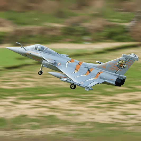 FMS 64mm Rafale EDF jet airborne with vibrant NATO Tiger Meet color scheme