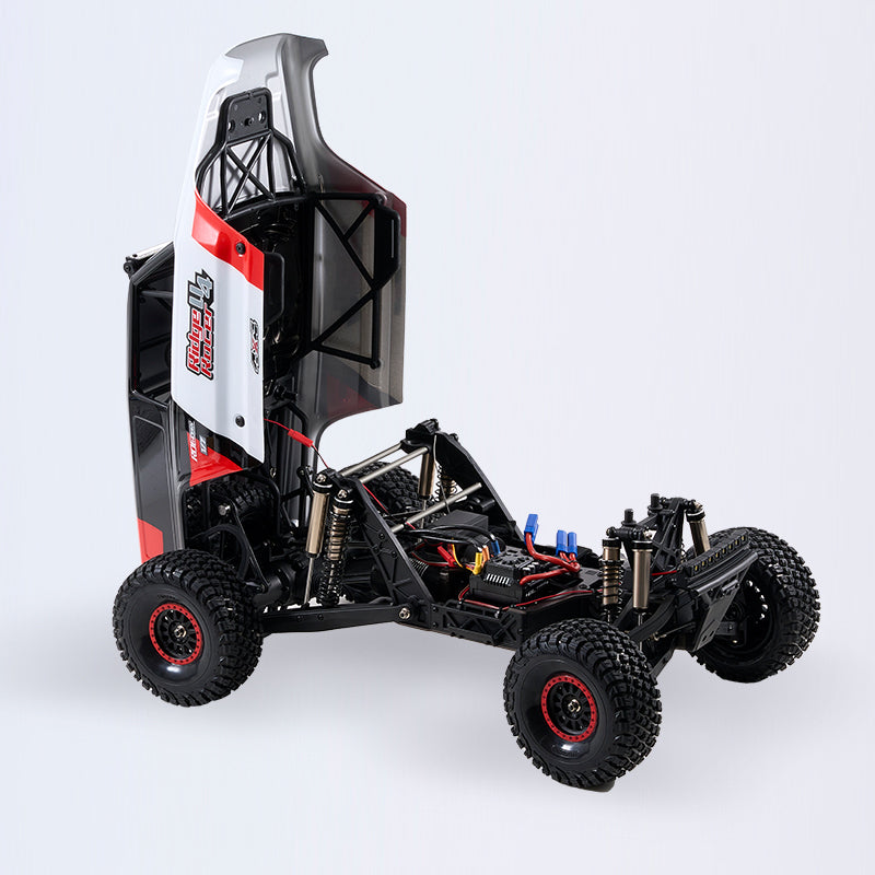 1:7 ROCHOBBY Ridge Racer U4 Desert Buggy RS chassis with lifted body, showing internal components, large tires, and red rim accents.