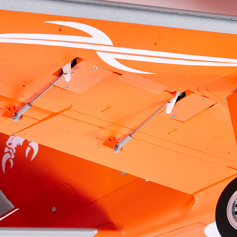 FMS Super Scorpion V2 orange EDF jet underside with flap linkages and landing gear.