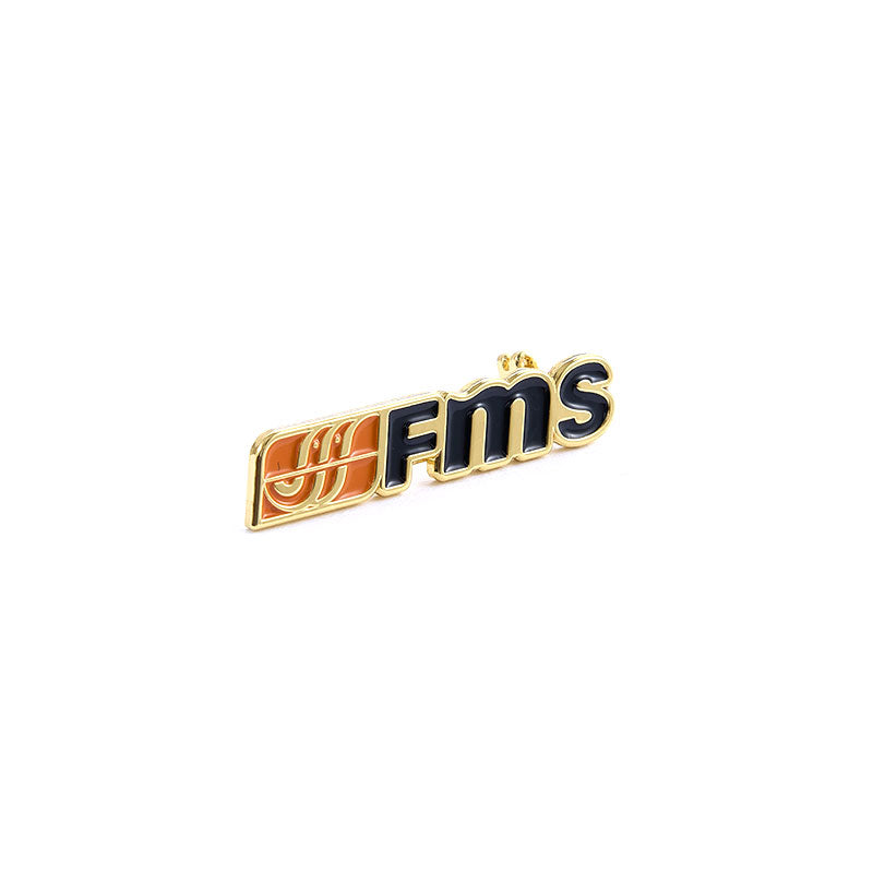 FMS gold badge with logo, ideal for RC model enthusiasts