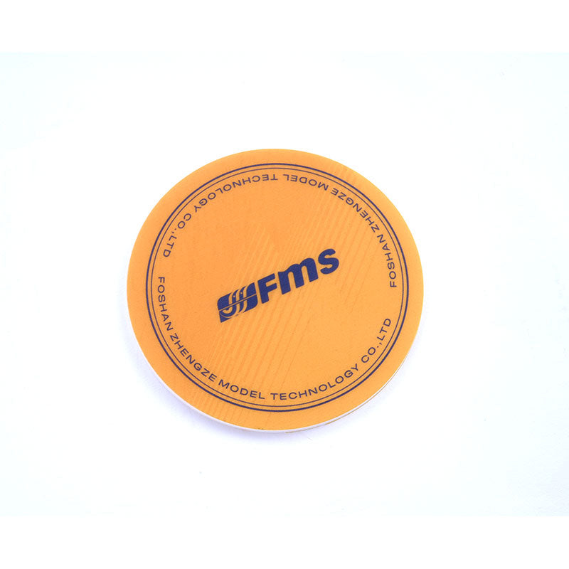 FMS coaster featuring orange surface with blue FMS logo and border text