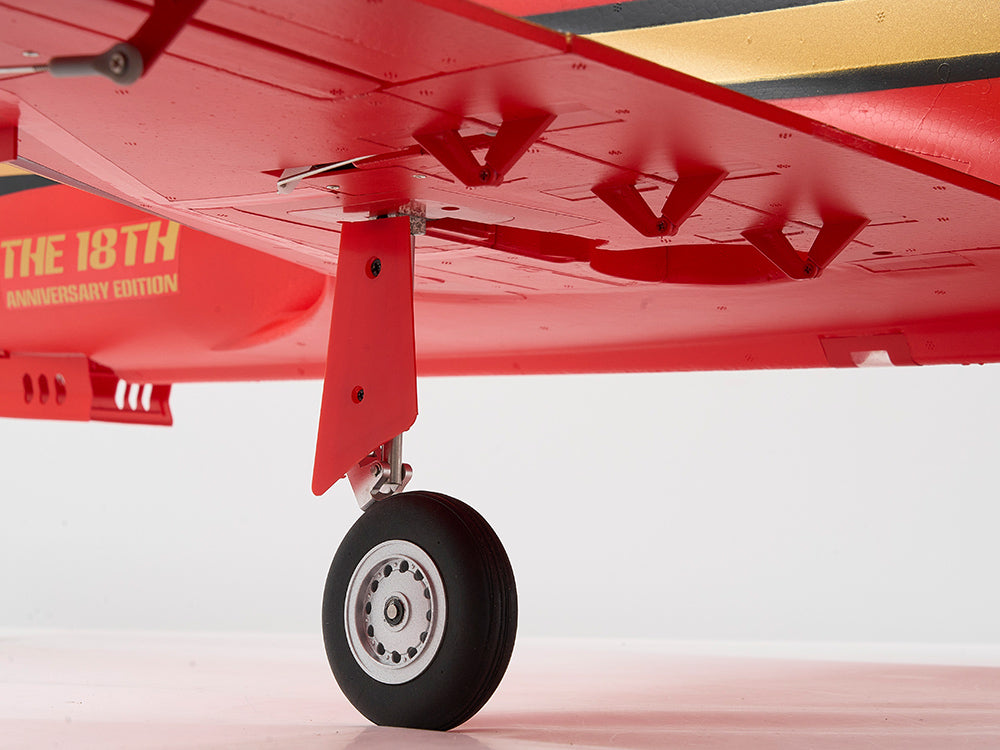 Close-up of the landing gear on a red FMS Avanti 90mm EDF jet