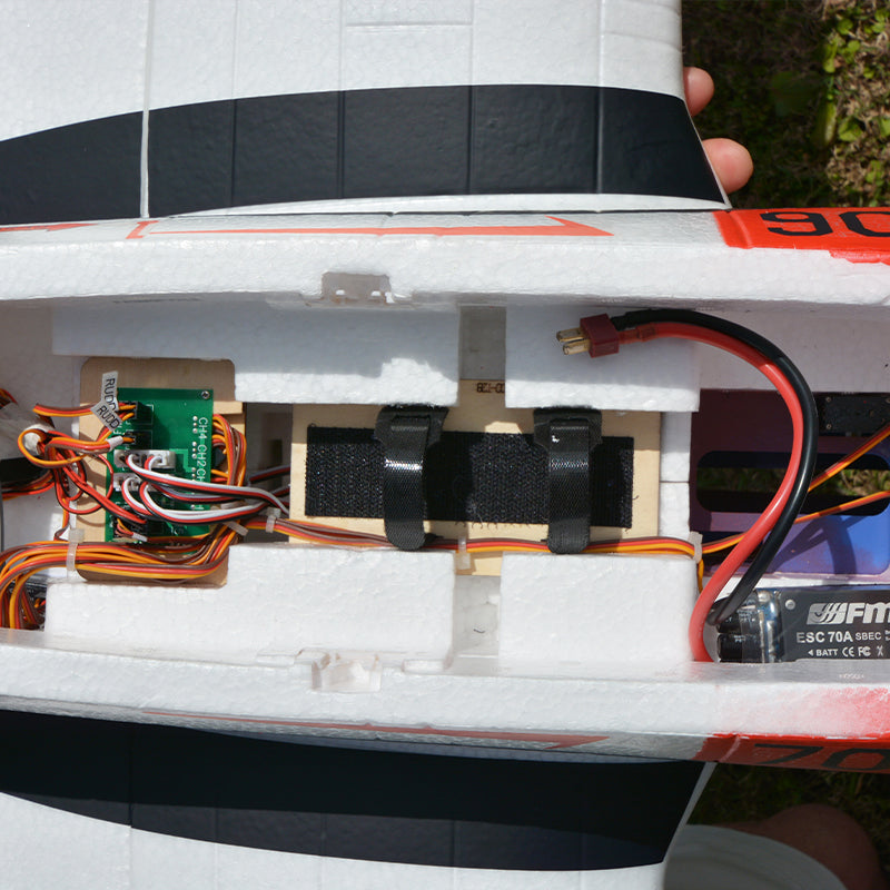 FMS T-28D Trojan V4 PNP RC airplane electronics bay with ESC, servos, wiring, and battery connector