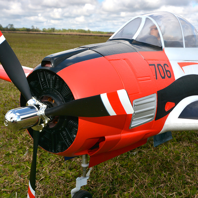 FMS 1400mm T-28D Trojan V4 Red PNP model airplane front view with red, black, and white markings and number 706.
