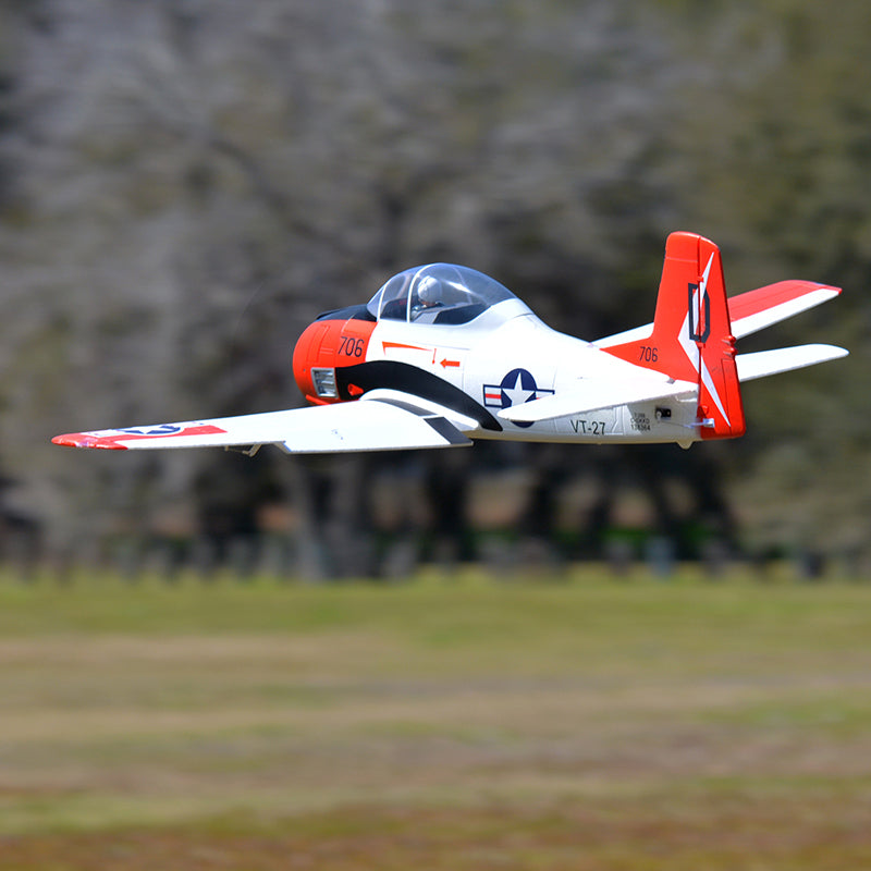 FMS 1400mm T-28D Trojan V4 Red PNP model aircraft in flight, featuring prominent markings and scale details.