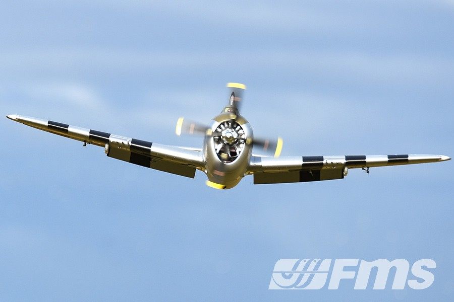 FMS 1500mm P-47 Thunderbolt Bonnie PNP RC airplane in silver with black wing stripes in flight against a blue sky.