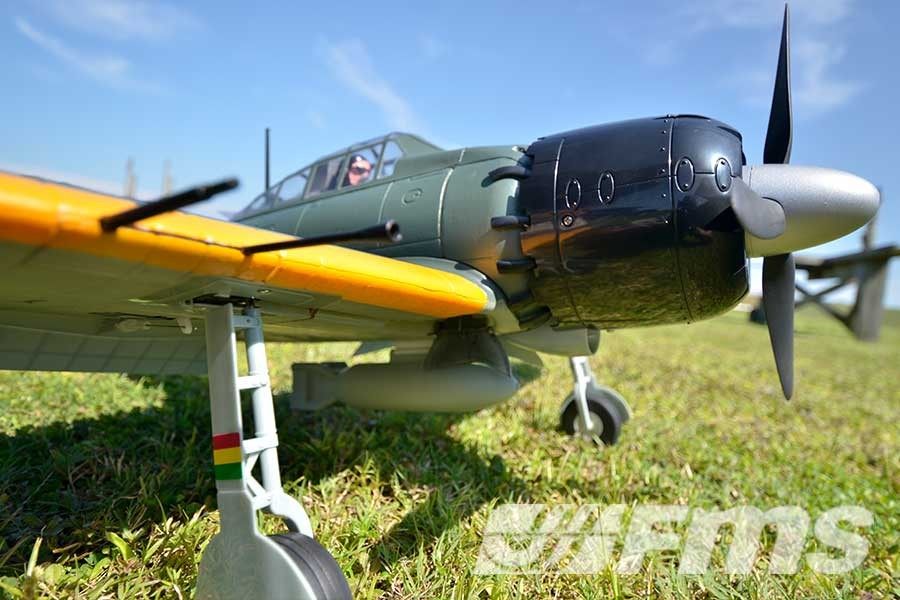 FMS 1100mm A6M5 Zero model airplane with retractable landing gear on grass.