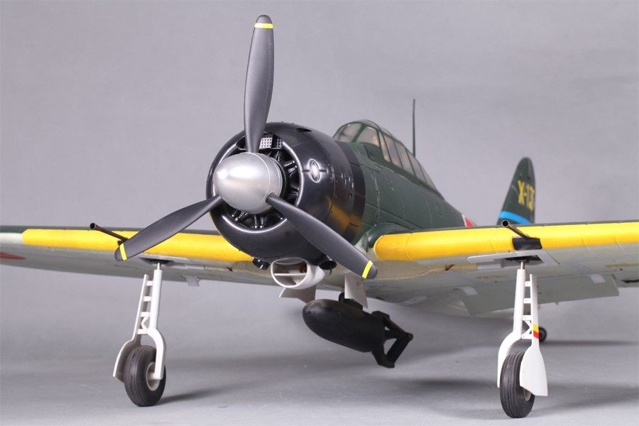 FMS 1400mm A6M3 Zero green PNP model airplane with yellow wing accents and a bomb under the fuselage.