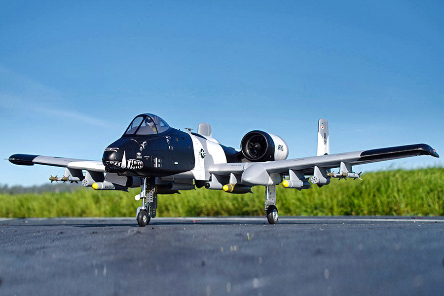 FMS EDF Jet Twin 70mm A-10 Thunderbolt II V2 PNP model aircraft with shark mouth livery and missiles on tarmac.