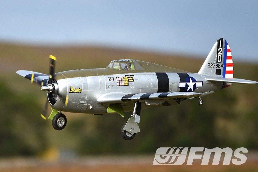 FMS 1500mm P-47 Thunderbolt Bonnie RC plane in flight, silver with black stripes and 'Bonnie' text.