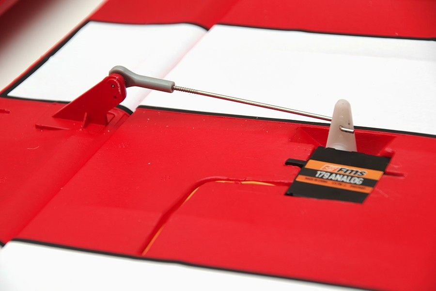FMS 1400mm Pitts V2 PNP RC plane red wing with installed servo and linkage.