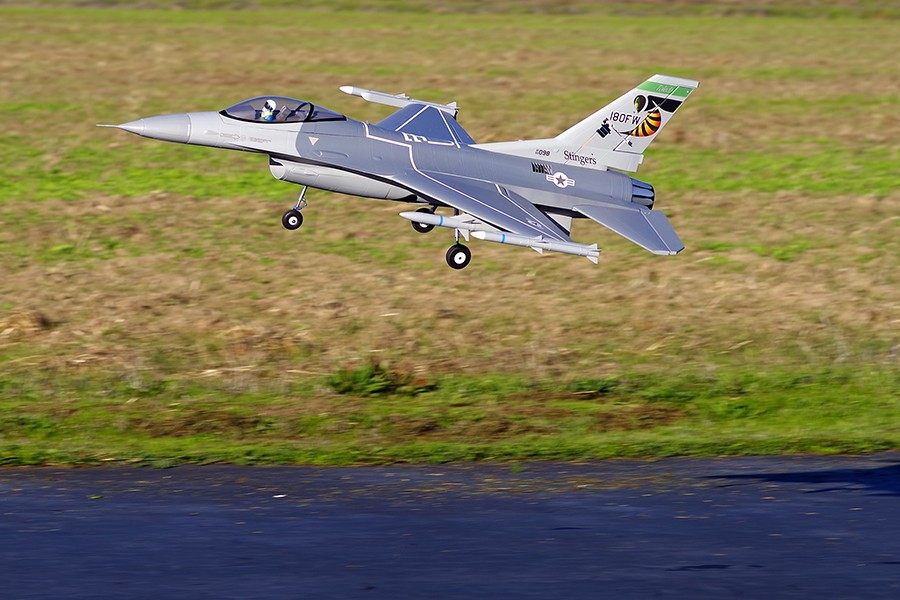 FMS 70mm F-16C Fighting Falcon PNP model jet in flight, USAF camouflage, 'Stingers' tail art.