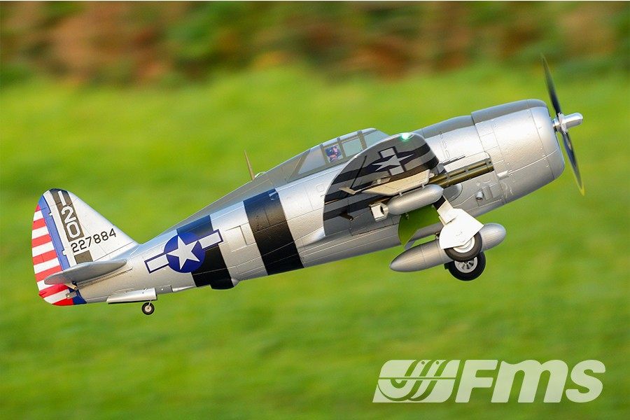 FMS 1500mm P-47 Thunderbolt Bonnie RC airplane in flight, silver with black stripes and US insignia.