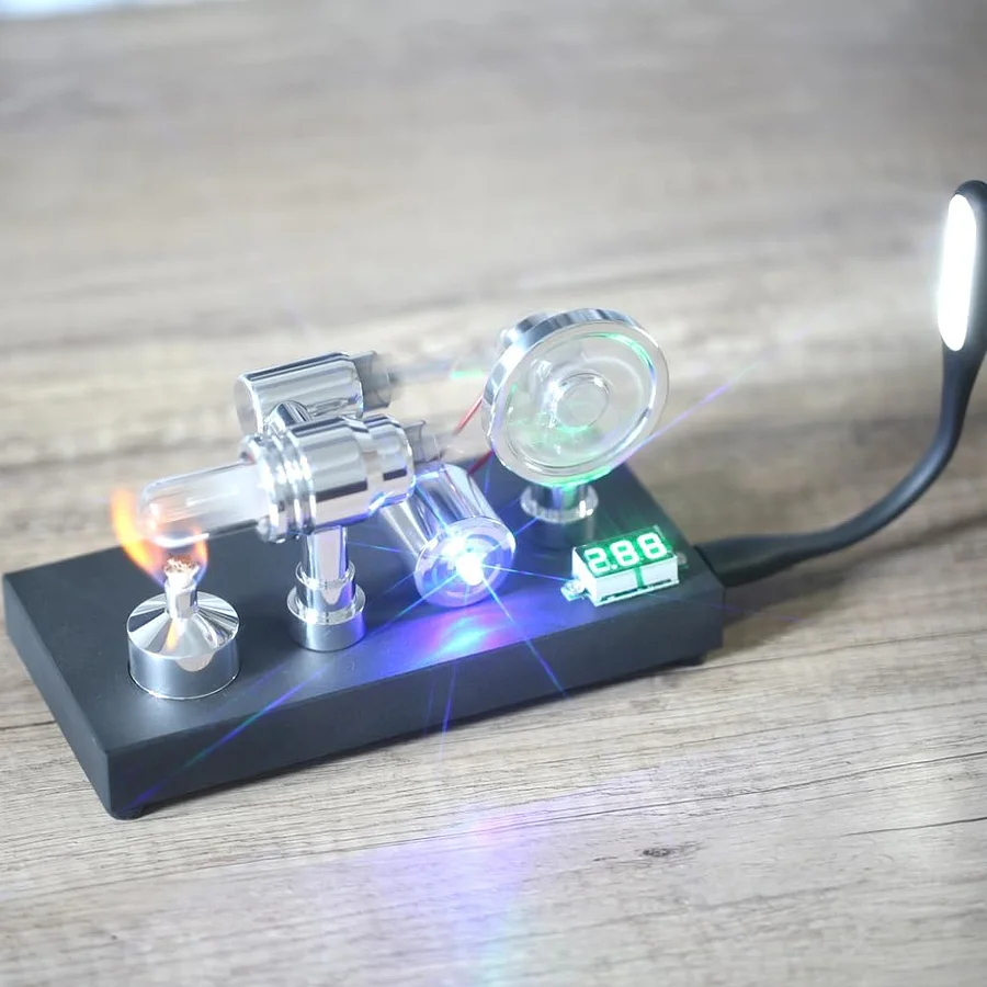 Mirror polished Stirling engine with embedded voltmeter and USB plug