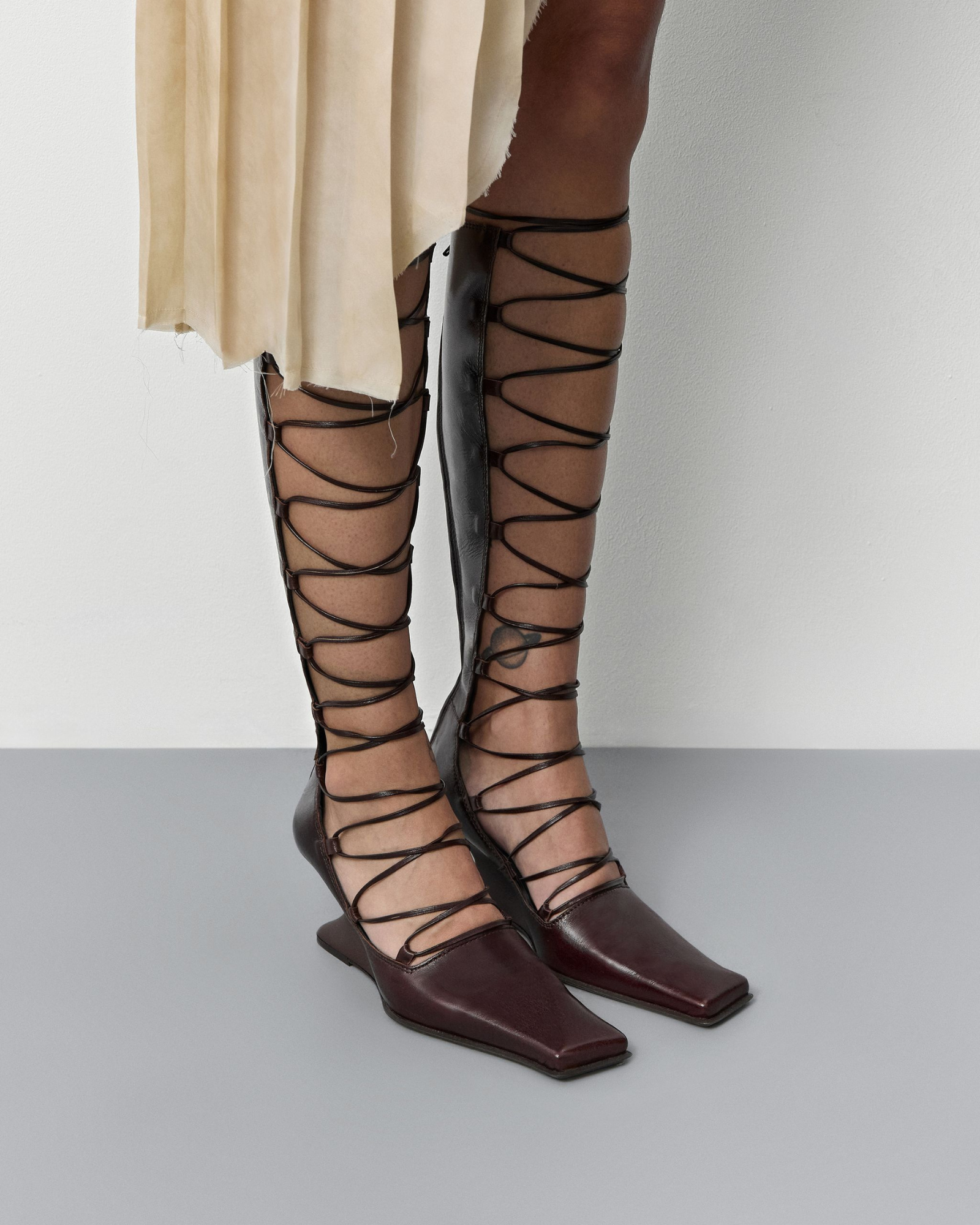 Larya Lace Up Wedge Knee High Boots In Wine