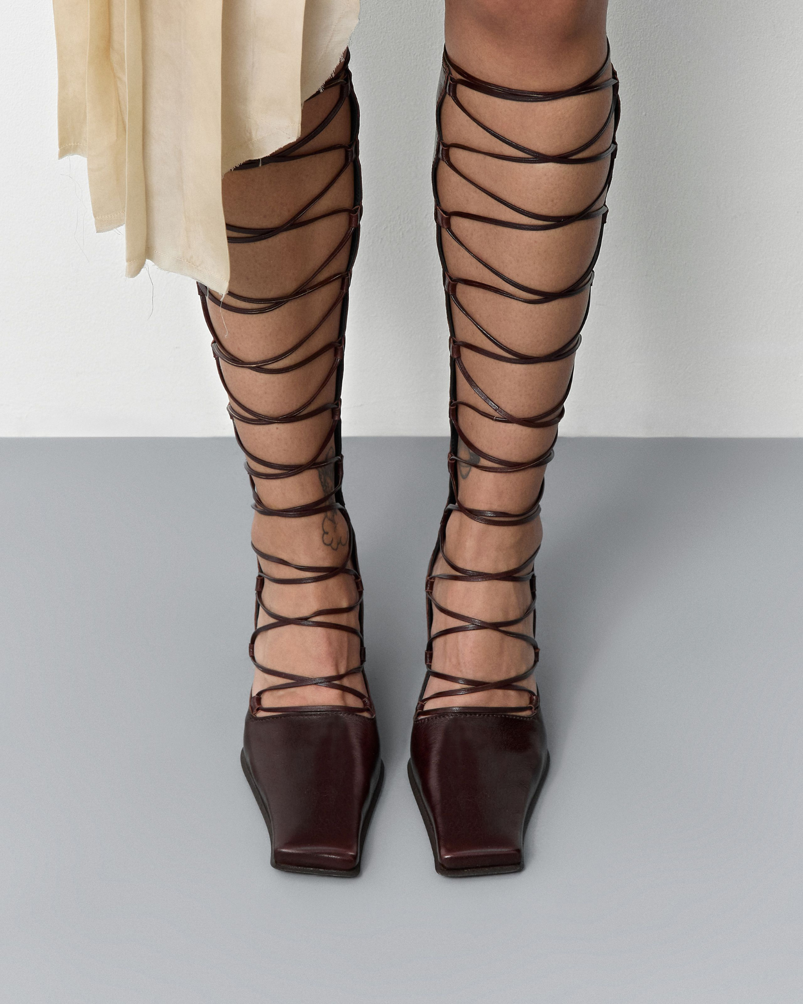 Larya Lace Up Wedge Knee High Boots In Wine