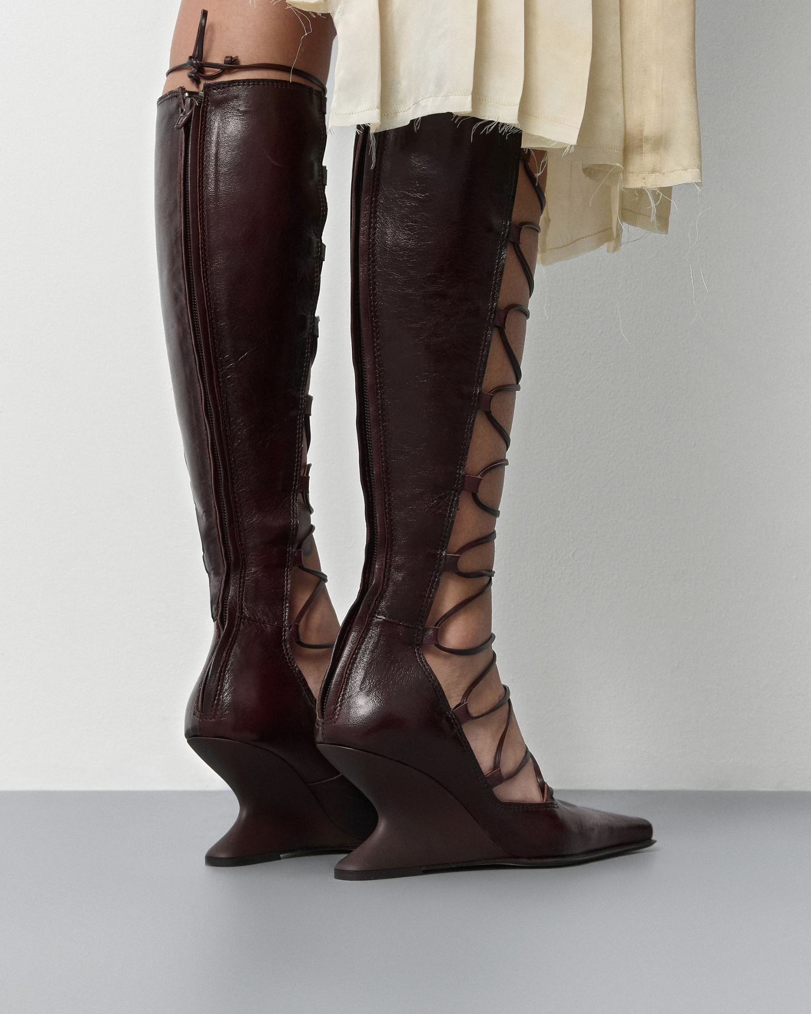 Larya Lace Up Wedge Knee High Boots In Wine