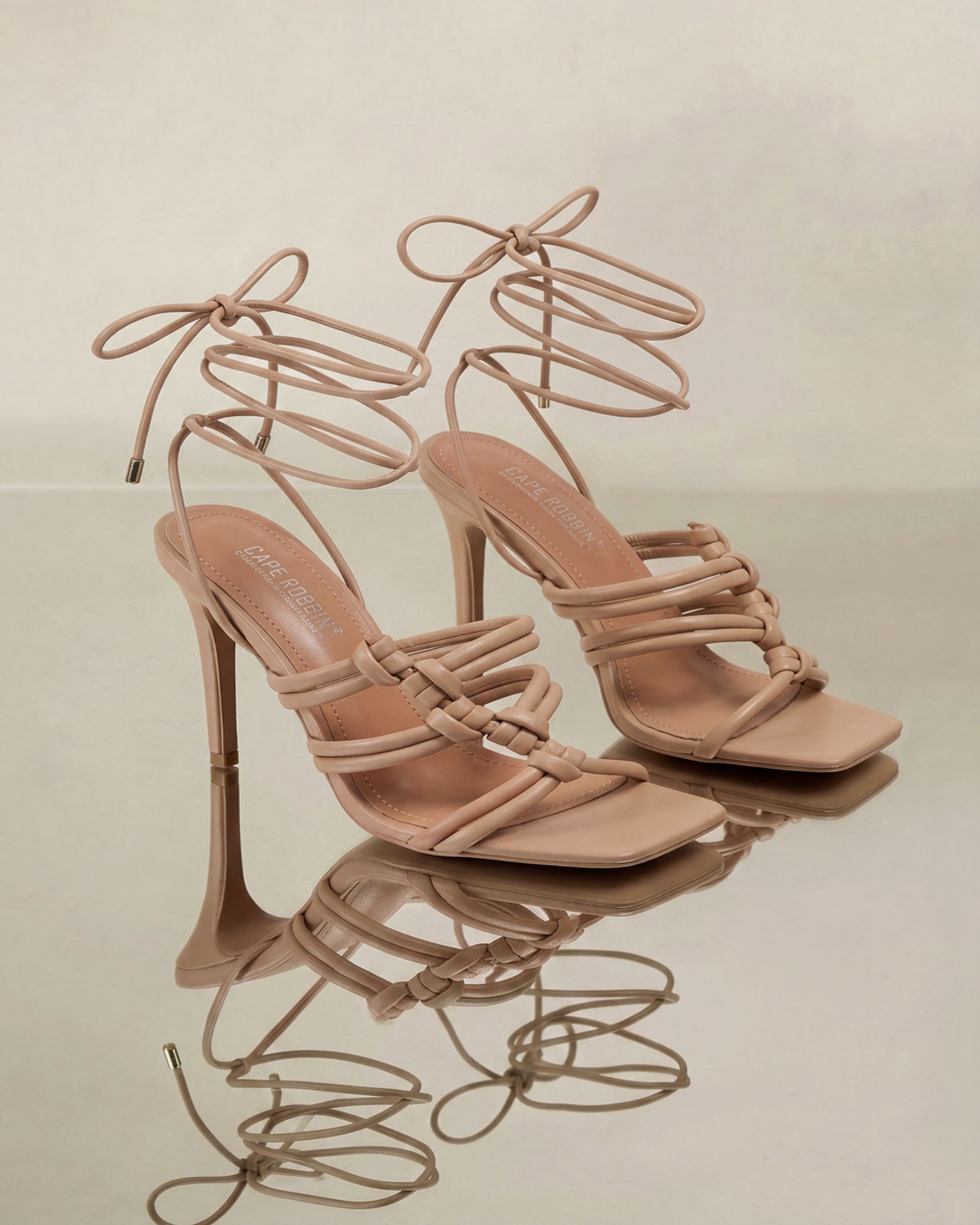 Kadi Knotted Lace Up Sandals In Nude