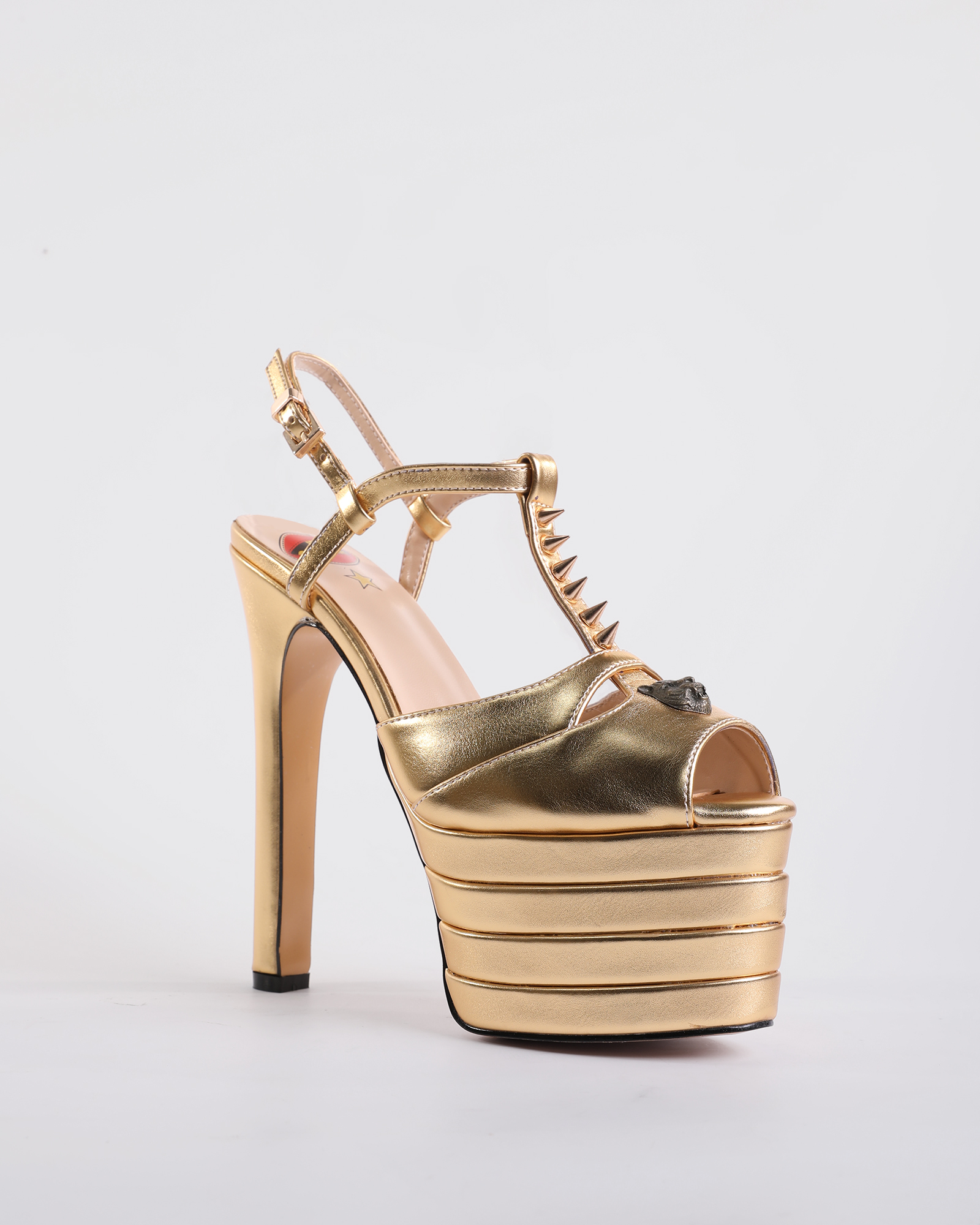 Dionisia Rivet Strap Platform Heels In Gold