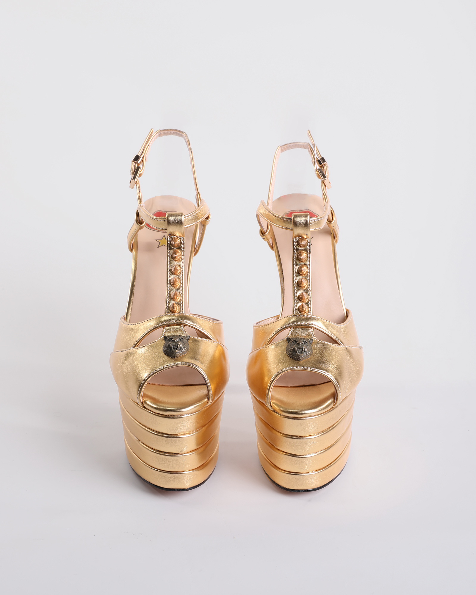 Dionisia Rivet Strap Platform Heels In Gold