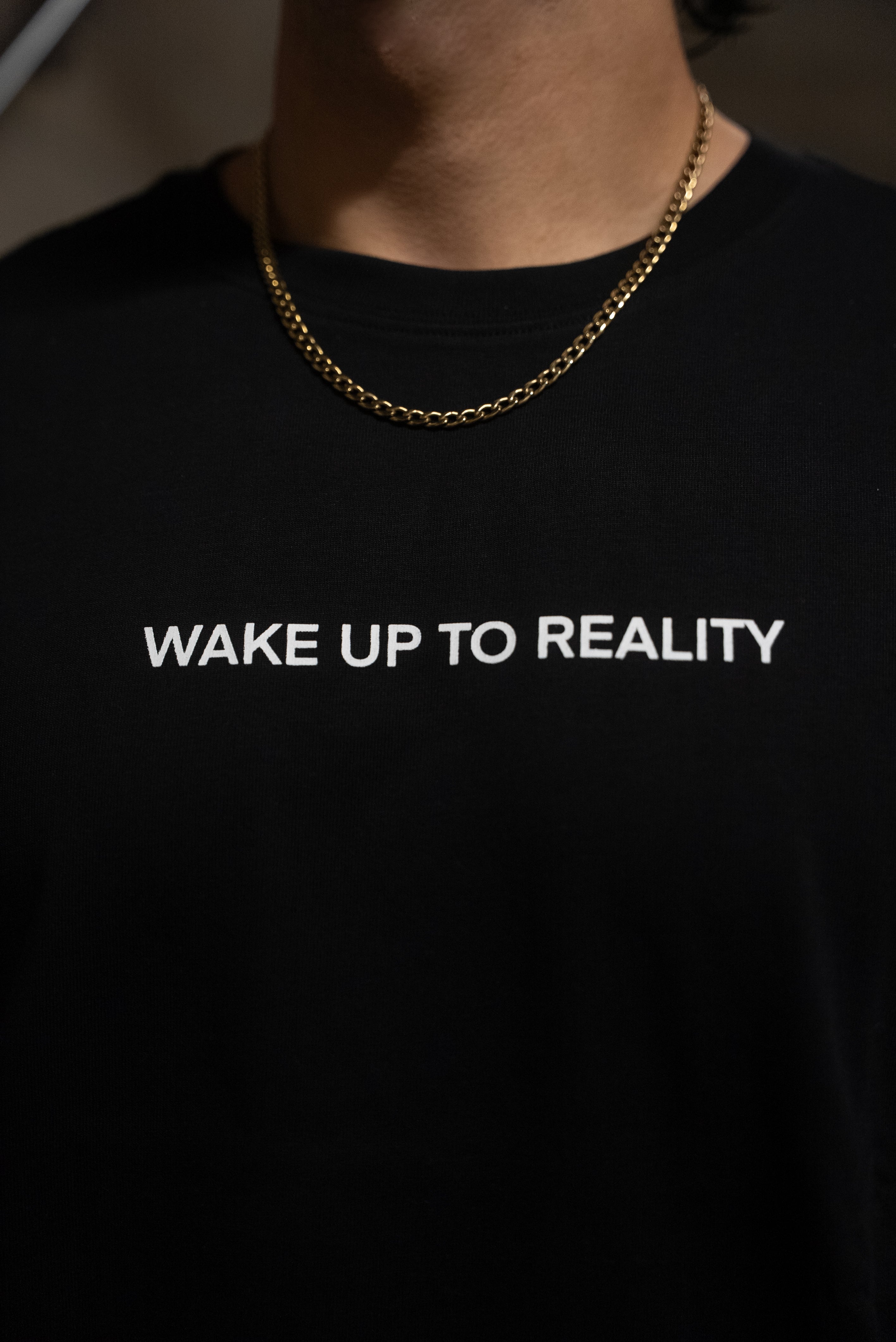 WAKE UP TO REALITY TEE  