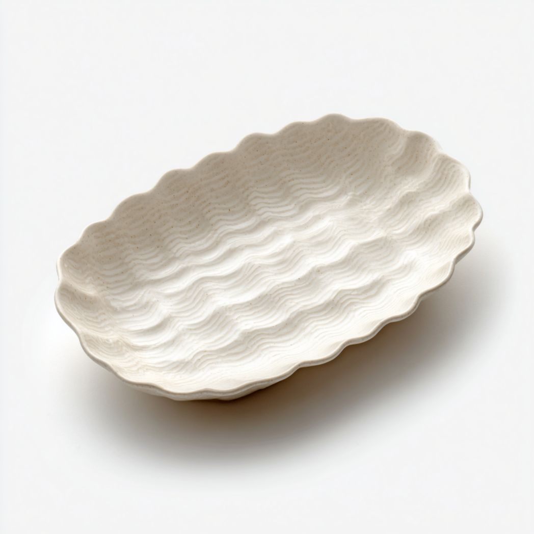 Owalny talerz na drobiazgi z teksturowanej kamionki w kolorze kości słoniowej-Modivie Home