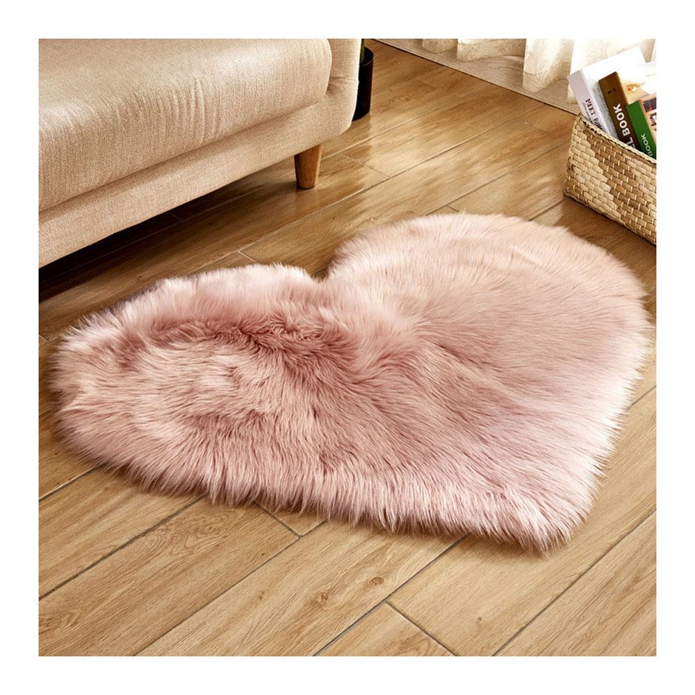 Small pink faux fur rug, washable.